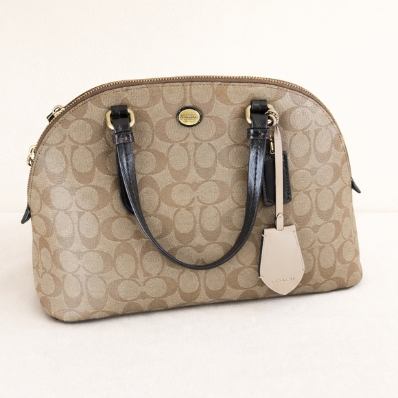 Coach Handbags - Coach Tan and Black Signature Satchel Slightly Used.